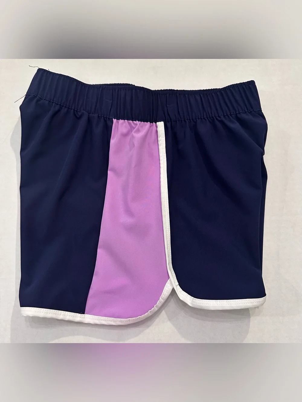 Justice Girls Lilac Butterfly Tank Top and a Pair of Justice Beach Board Shorts